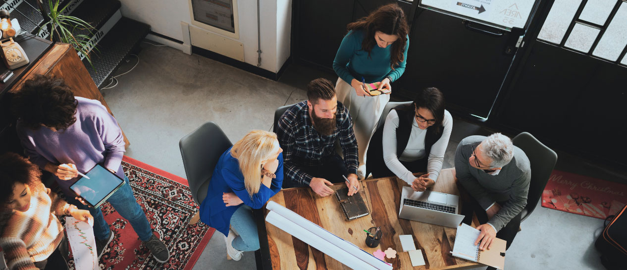 A team working around a table.