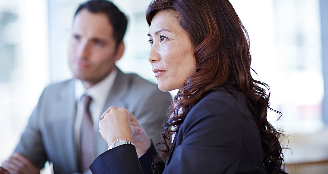 A woman and a man in a business meeting.