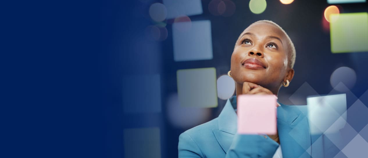 Woman in a blue jacket looking up thoughtfully, surrounded by blurred colorful lights and geometric shapes, symbolizing industry progress.