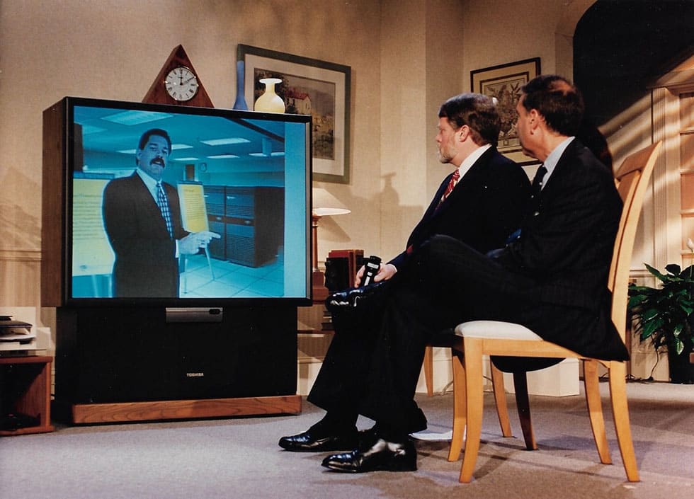 On stage, the Full Service Network launch event in December 1994 featured Time Warner’s Jim Ludington talking on-screen to Jim Chiddix and Jerry Levin (photo courtesy of Jim Ludington).